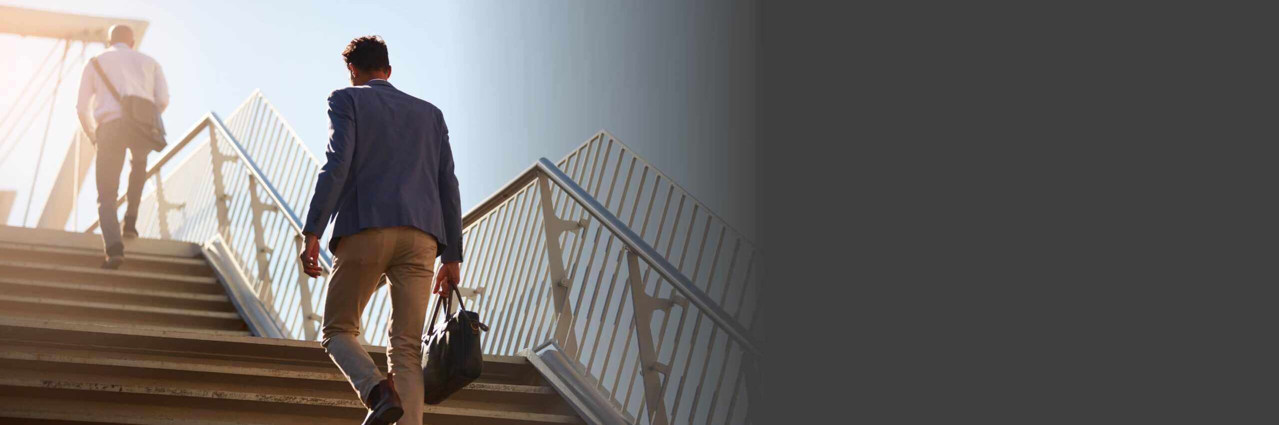 men walking up stairs outside